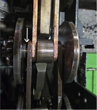 Conveyor chain sprocket showing wear and clearance issues from original flanged bushing